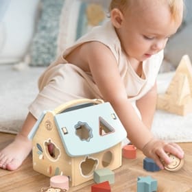 child playing with House Shape Sorter