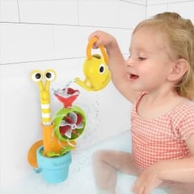child in the bath playing with a Pop-Up Water Snail