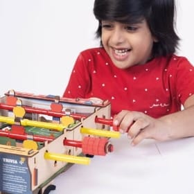 child playing Foosball