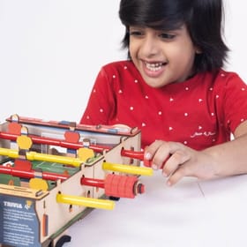 child playing Foosball