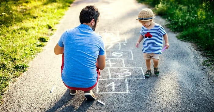 Father Playing Hopscotch with Child