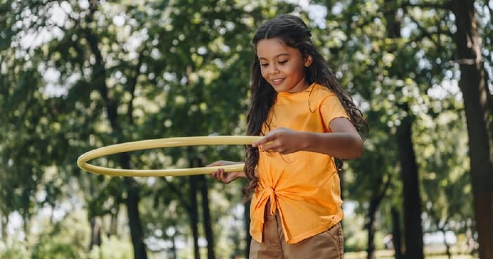 Child Playing with Hula Hoop