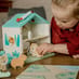 child playing with Zoo Play Set