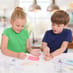 Children playing with slime kit