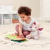 child playing with Lily the Dragon