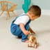 Child playing with Pull Along Dog