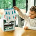 Boy Unpacking Castle Play Set