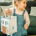 Girl Carrying Castle Play Set