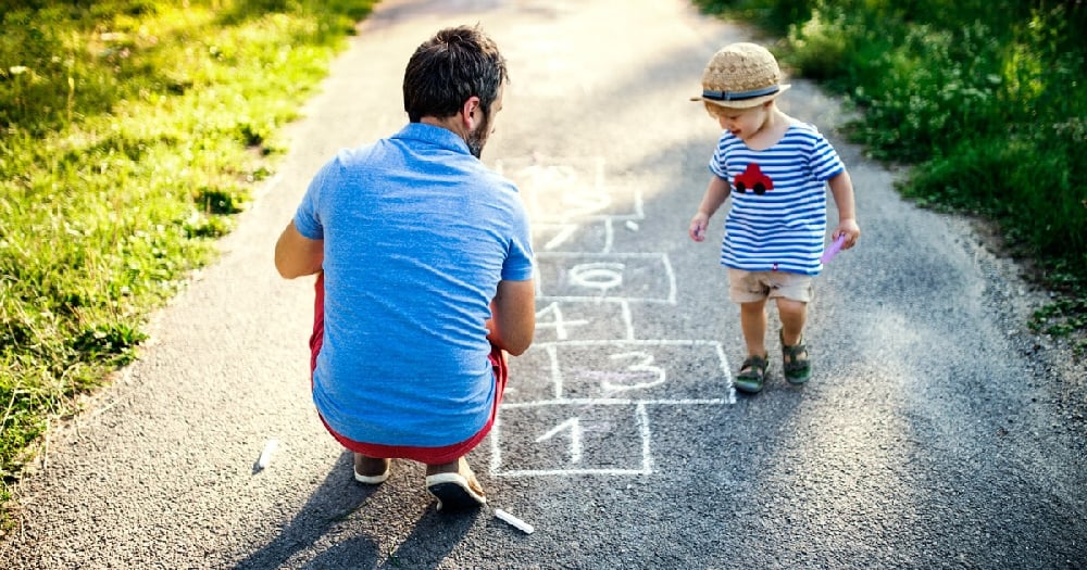 Father Playing Hopscotch with Child